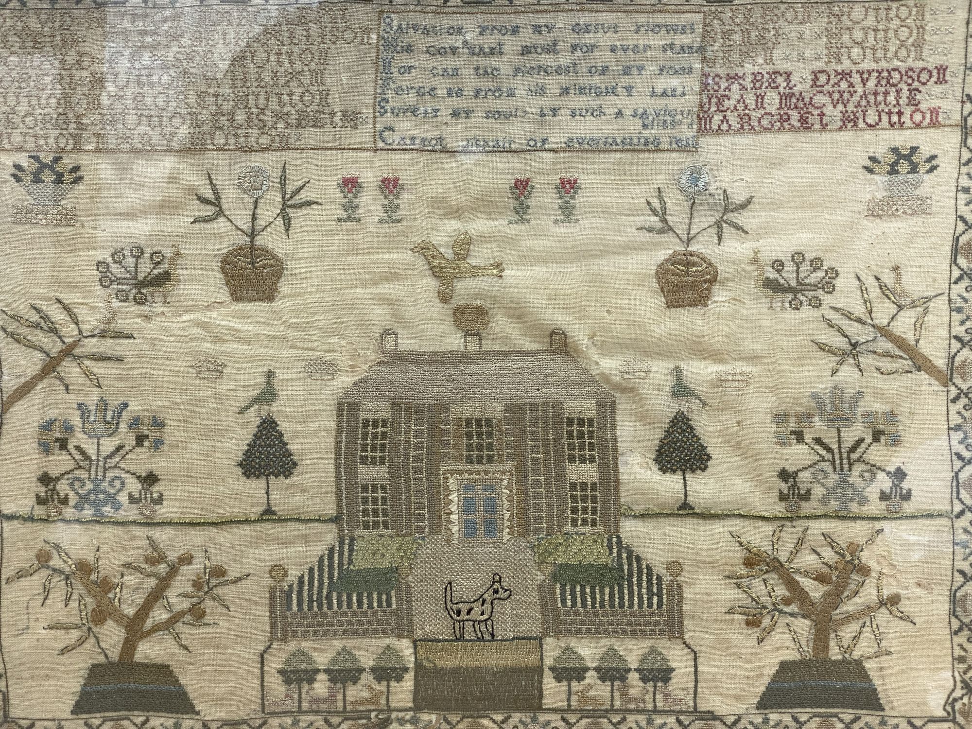 A late Georgian Hutton family sampler depicting house and garden